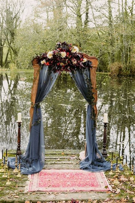 outdoor fall wedding arches   roses rings