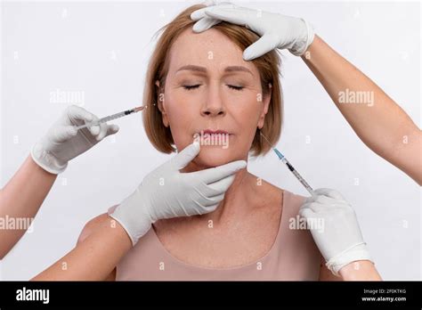 injection cosmetology for skin rejuvenation beauticians making anti aging shots into mature