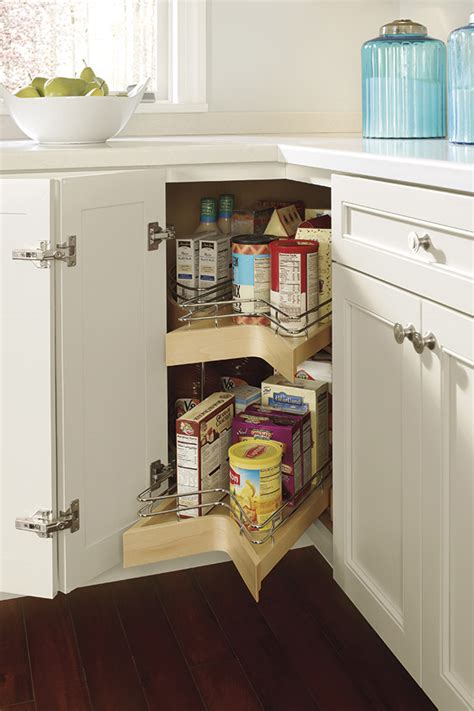 In the house we flipped we went with a frameless cabinet design and full overlay door which allows for a more efficient use of cabinet space and it's easier to make. Lazy Susan Cabinet with Pull-out - Kemper Cabinetry