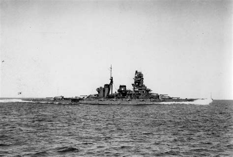 An Old Photo Of A Battleship In The Water