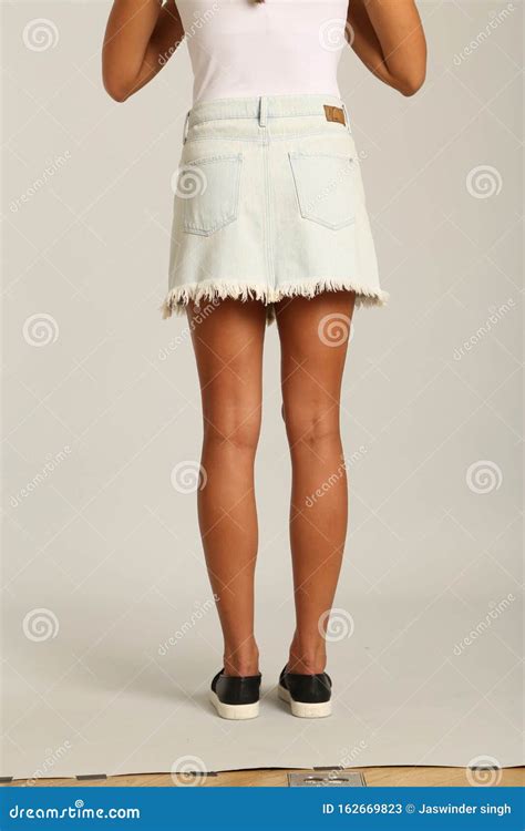White Denim Exposure Mini Skirt Beautiful Woman Legs With Black High