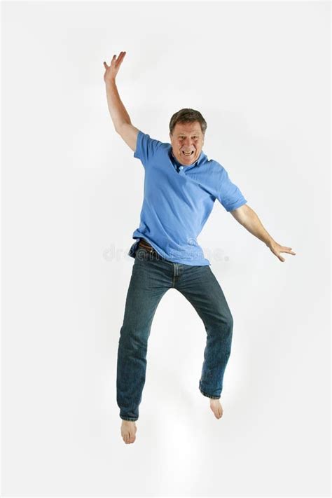 Man Jumps In The Air Stock Photo Image Of Blue Polo 134106250