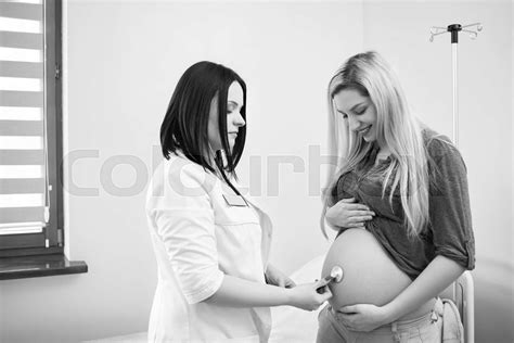 Pregnant Woman Having Ultrasonic Scanning At The Clinic Stock Image