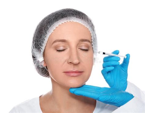 Mature Woman Getting Facial Injection On White Background Stock Image