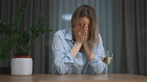 boozer woman feeling dizzy after too much alcohol stock footage video of bottle closeup