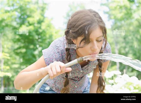 One Woman Bending Down Outside Hi Res Stock Photography And Images Alamy