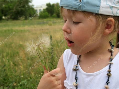 Little Girl Blowing Dandelion Seeds Stock Photo By ©sundikova 1623192