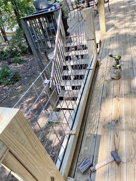 Reinforce the top rails with angle brackets. DIY Hog Wire Deck Railing | Wire deck railing, Deck railings, Deck railing diy