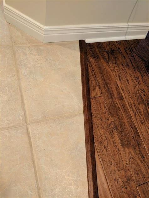Wood tile to hardwood transition. Transitioning hardwood floor to tile floor-is there a ...
