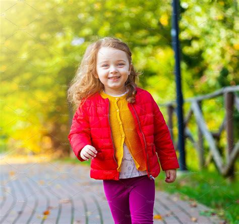 Adorable Little Girl Walking In Park Containing Autumn Beautiful And
