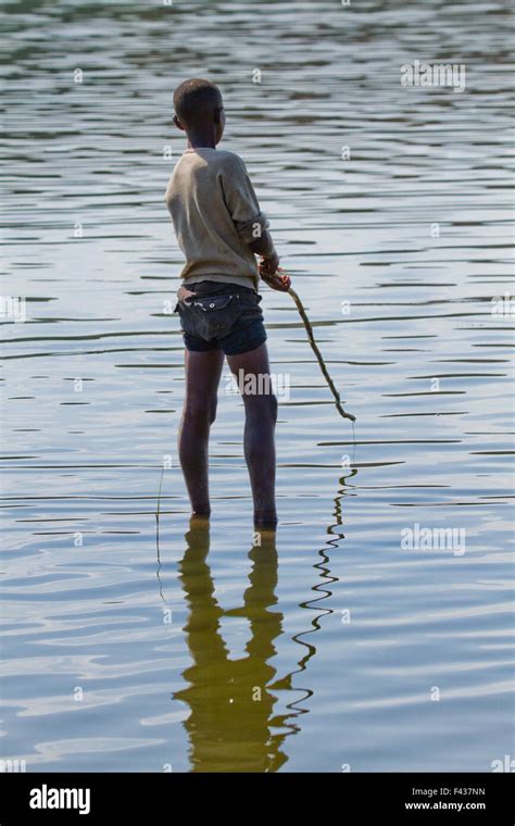 Africa Ethiopia Child Fishing In The River Stock Photo Alamy