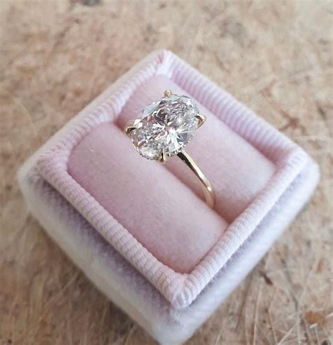 A beautiful pink diamond engagement ring showcasing a 3.66 carat oval cut pink diamond certified by gia as fancy light pink color, internally flawless clarity. 2 Carat Oval Diamond Engagement RingHidden Halo 14k Yellow ...