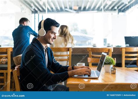 Male Freelancer Using Laptop At Restaurant Stock Image Image Of