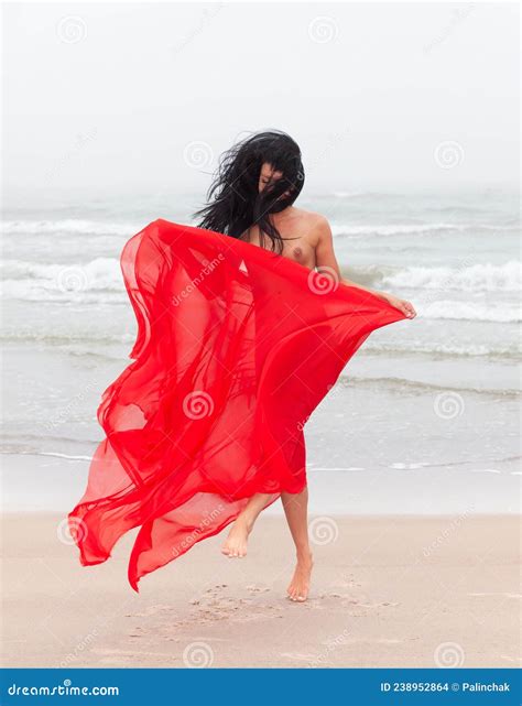 Nude Woman In Red Fabric Posing On Sea Beach Stock Photo Image Of