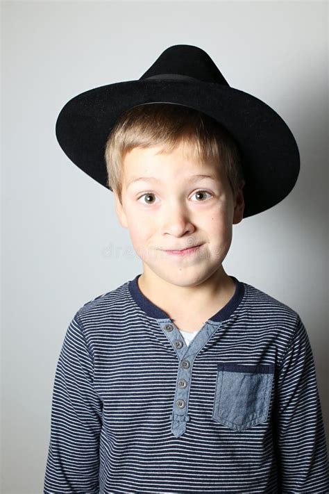 Boy Making Wry Face In Black Hat Stock Image Image Of Blond