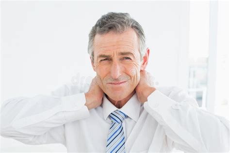 Portrait Of A Mature Man Suffering From Neck Pain Stock Image Image