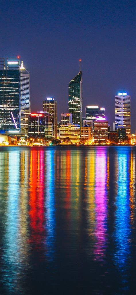 Cityscape Buildings Colorful Reflections Night 1125x2436 Wallpaper
