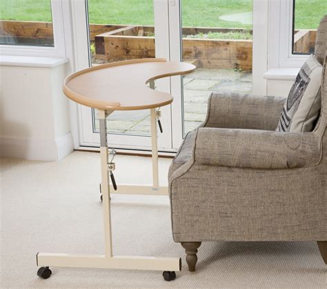 The 2 arched supports hold a triangle shaped glass tray. Kidney Shaped Over Chair Table - UK Delivery - Felgains