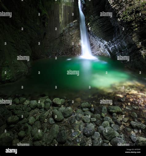 Hidden Romantic Waterfall Flowing Through A Crevasse Falling Deep Into