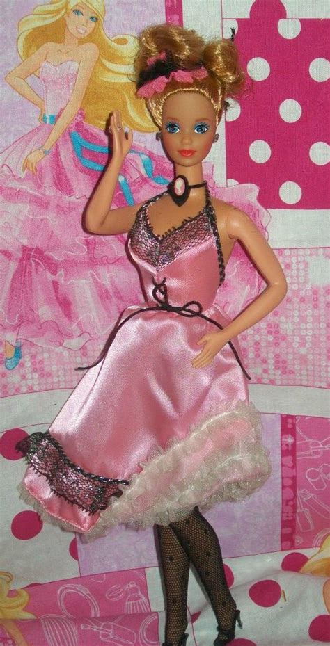 A Barbie Doll In A Pink Dress And Polka Dot Wallpaper With White Polka Dots