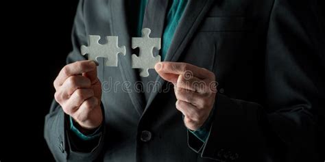 Businessman Matching Two Puzzle Pieces Stock Image Image Of Corporate