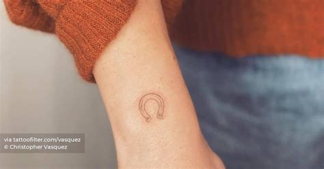 Fine Line Horseshoe Tattoo Located On The Wrist