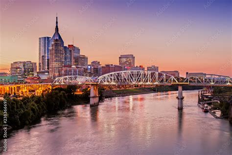 Nashville Skyline And John Seigenthaler Pedestrian Bridge At Dusk Stock