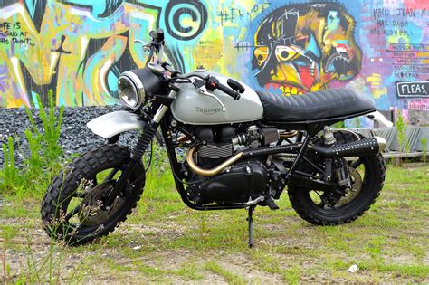 The triumph scrambler motorcycle weighs 205 kg and its seat height is 765 mm. Triumph Swamp Scrambler by TTRNO