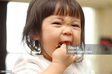 Japanese Baby Girl Eating Cereal Stock Photo Download Image Now