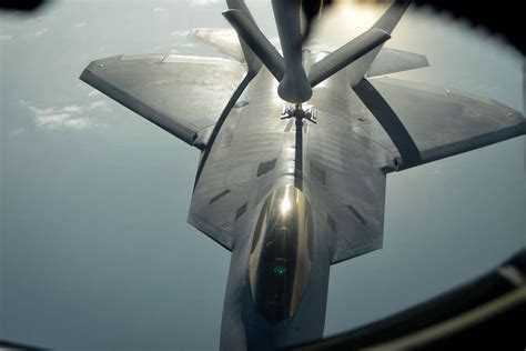 An F 22 Raptor Is Refueled By The Boom Of A Kc 135 Nara And Dvids
