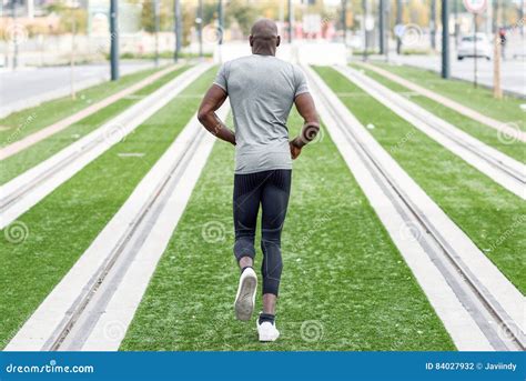 Attractive Black Man Running In Urban Background Royalty Free Stock