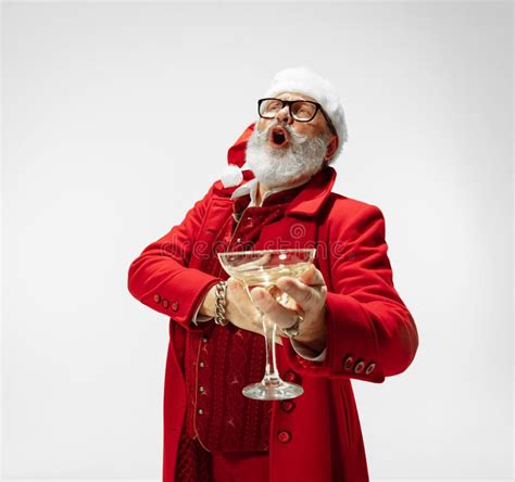 Modern Stylish Santa Claus In Red Fashionable Suit Isolated On White