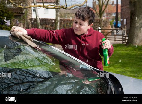 Teenager washing car hi-res stock photography and images - Alamy
