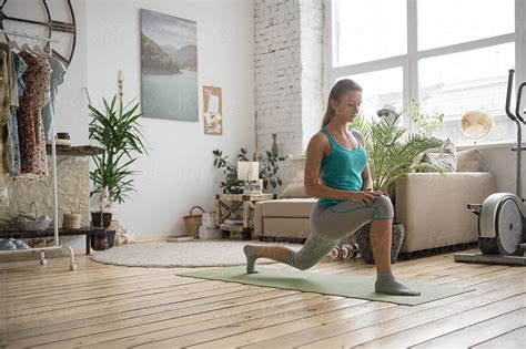 Woman Doing Exercises At Home By Stocksy Contributor Milles Studio Stocksy
