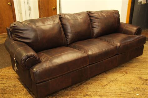 Solid wood legs in dark brown finish; Elegant Furniture - A Brown Leather Sofa - Decorifusta