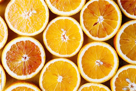 Oranges On A Yellow Background Half Oranges By Stocksy Contributor