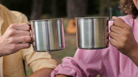 Free Photo Couple Having Marshmallows And Hot Drinks While Camping