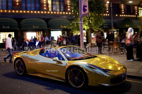 Reportage Photo Of Chrome Gold Ferrari 458 Spider Supercar Parked