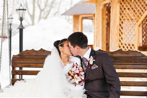 Romantic Kiss Happy Bride And Groom On Winter Wedding Day Stock Photo