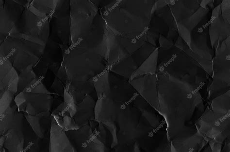 Premium Photo Crumpled Black Paper Textured Background
