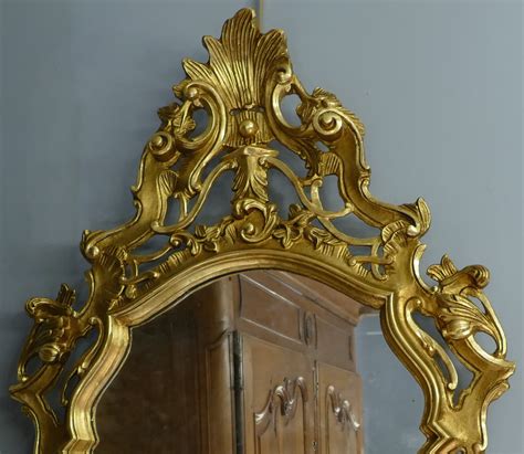 Miroir en bois sculpté doré de style Louis XV 19è siècle ...