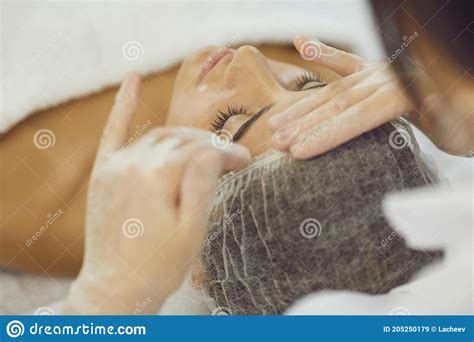 Young Woman Getting Manual Relaxing Facial Massage From Hands Of Masseur Stock Image Image Of