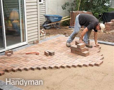The crew used type s masonry cement, mixing it with sand and water at the job site. How to Cover a Concrete Patio With Pavers | The Family ...
