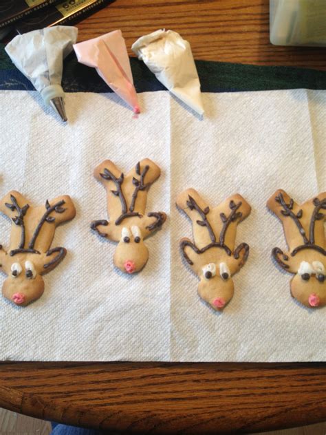 Then make the outline of reindeers with line icing and detail with royal icing. Reindeer cookies made from upside down gingerbread man cookie cutter.