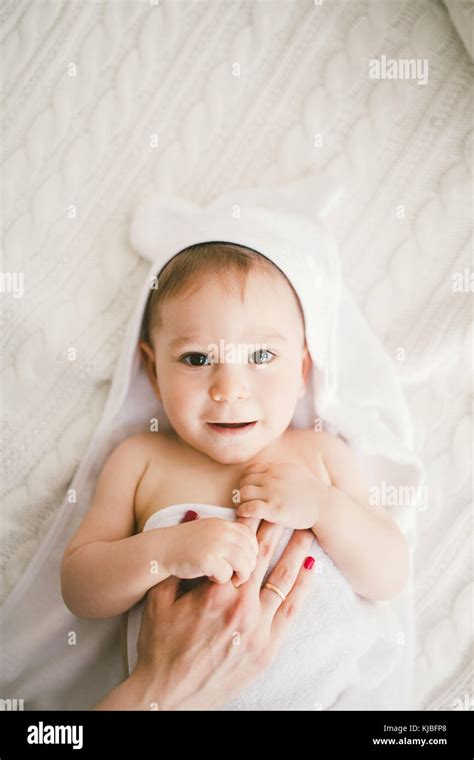 Beautiful Smiling Newborn Baby Boy Covered With White Bamboo Towel With