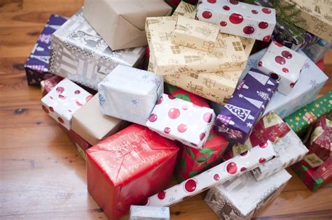 Photo of Pile of gift-wrapped Christmas presents | Free christmas images
