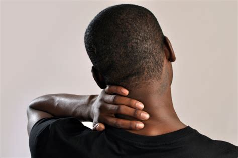 Male Holding The Back Of His Neck Cause Of Pain Stock Photo Download