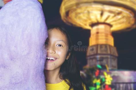 Girl Covering Her Face Behind A Huge Candy At Park Stock Image Image