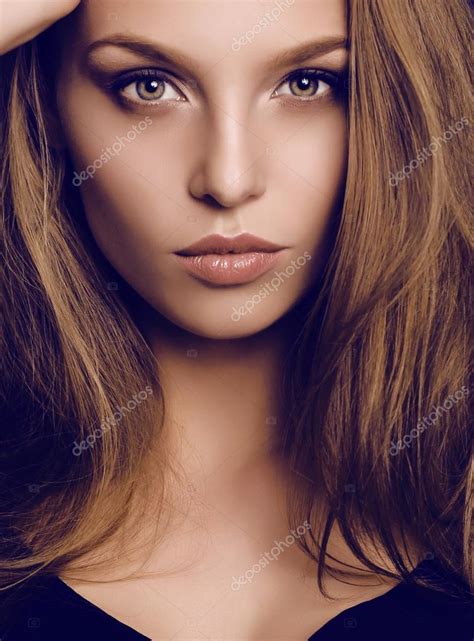 Potrait Of Beautiful Young Woman With Dark Hair And Green Eyes Stock