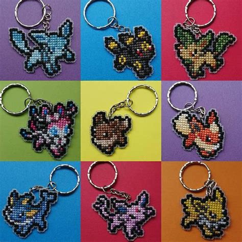 Six Pixel Key Chains With Different Designs On Them